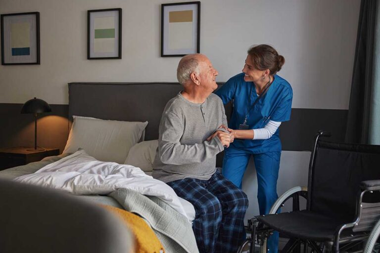 Family members review assisted living information beside a senior in a bright community lounge.